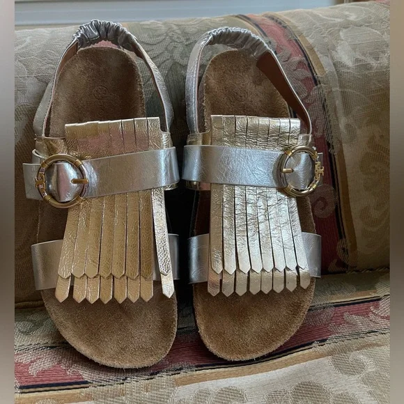 Tory Burch Multi-Logo Kiltie Sandal - Silver / Spark Gold / Natural. Size 7
